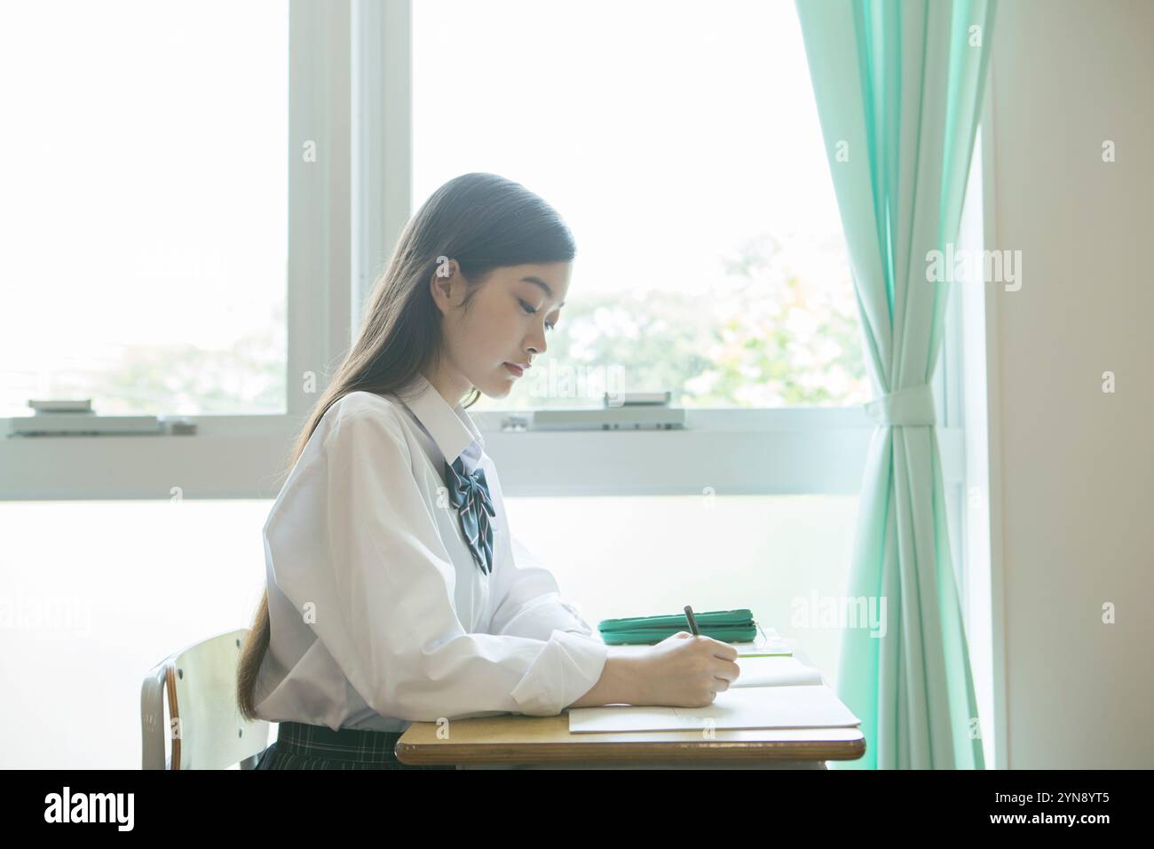High school girls studying in a classroom Stock Photo - Alamy