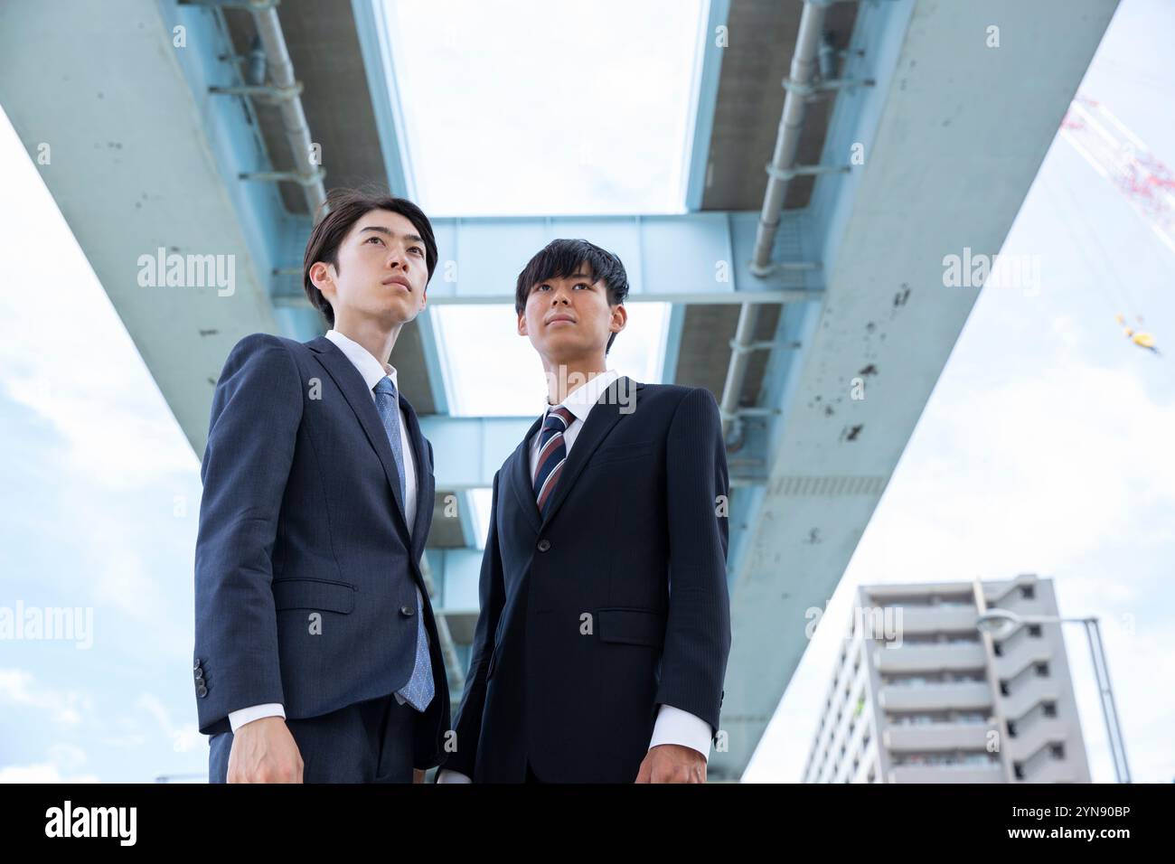 Black suits standing hi-res stock photography and images - Alamy