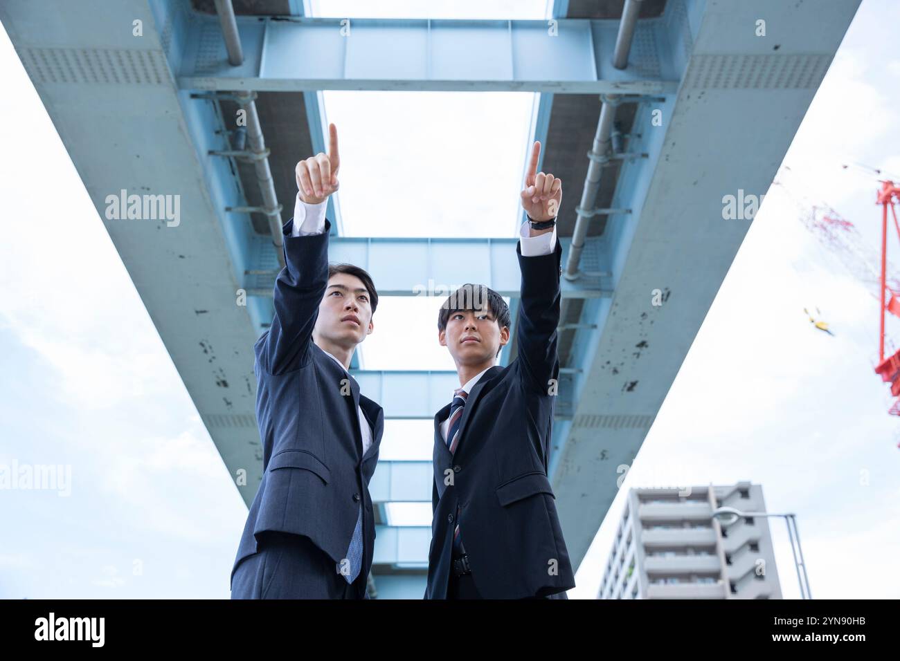 Black suits standing hi-res stock photography and images - Alamy