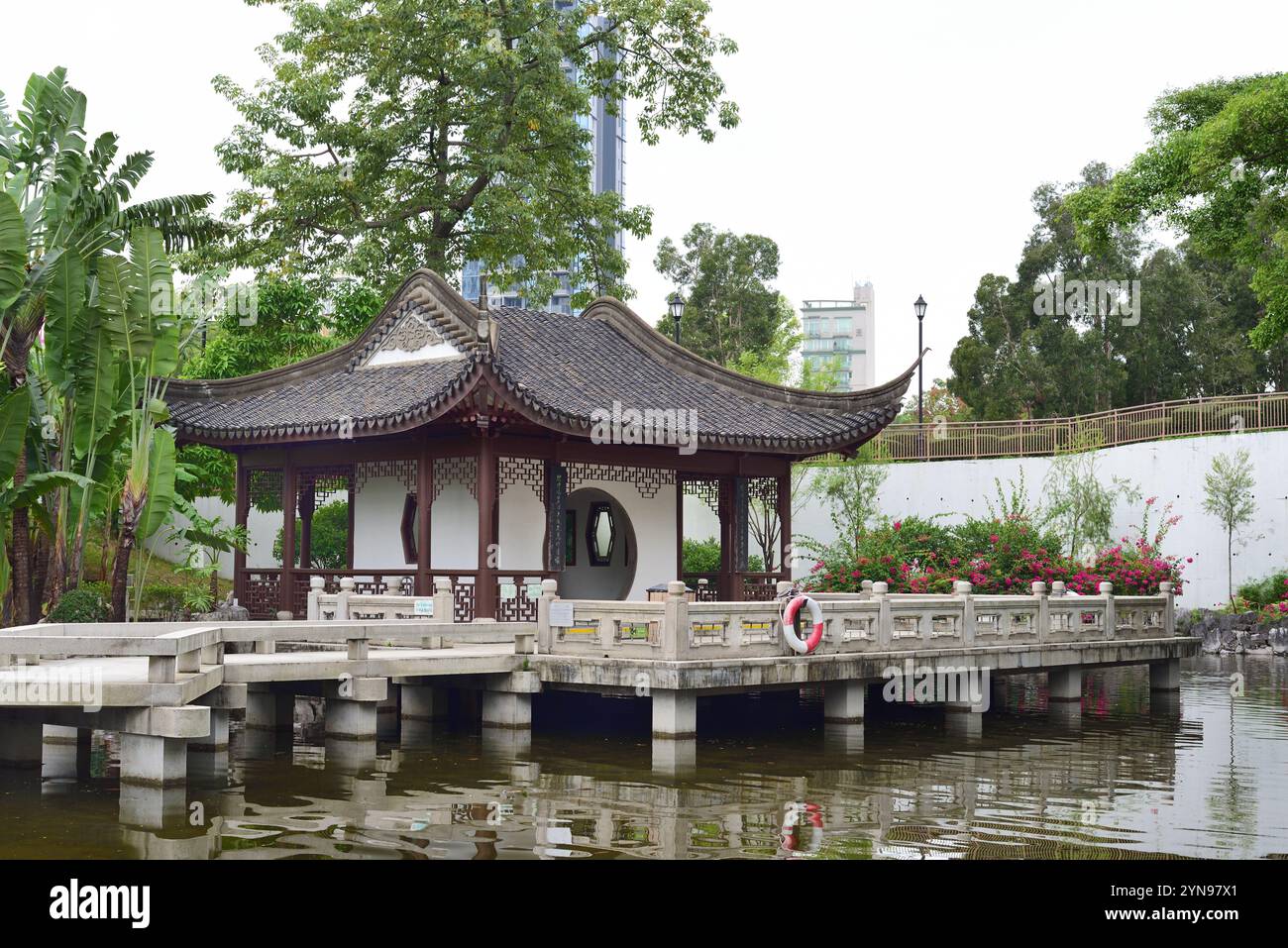 Pagoda in pond , Kowloon Walled City Park, Hong Kong Stock Photo
