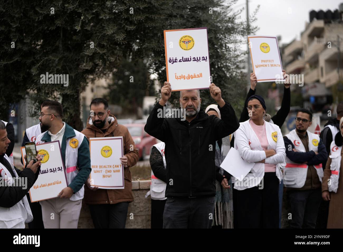 Members of the Palestinian Medical Relief Society mark the