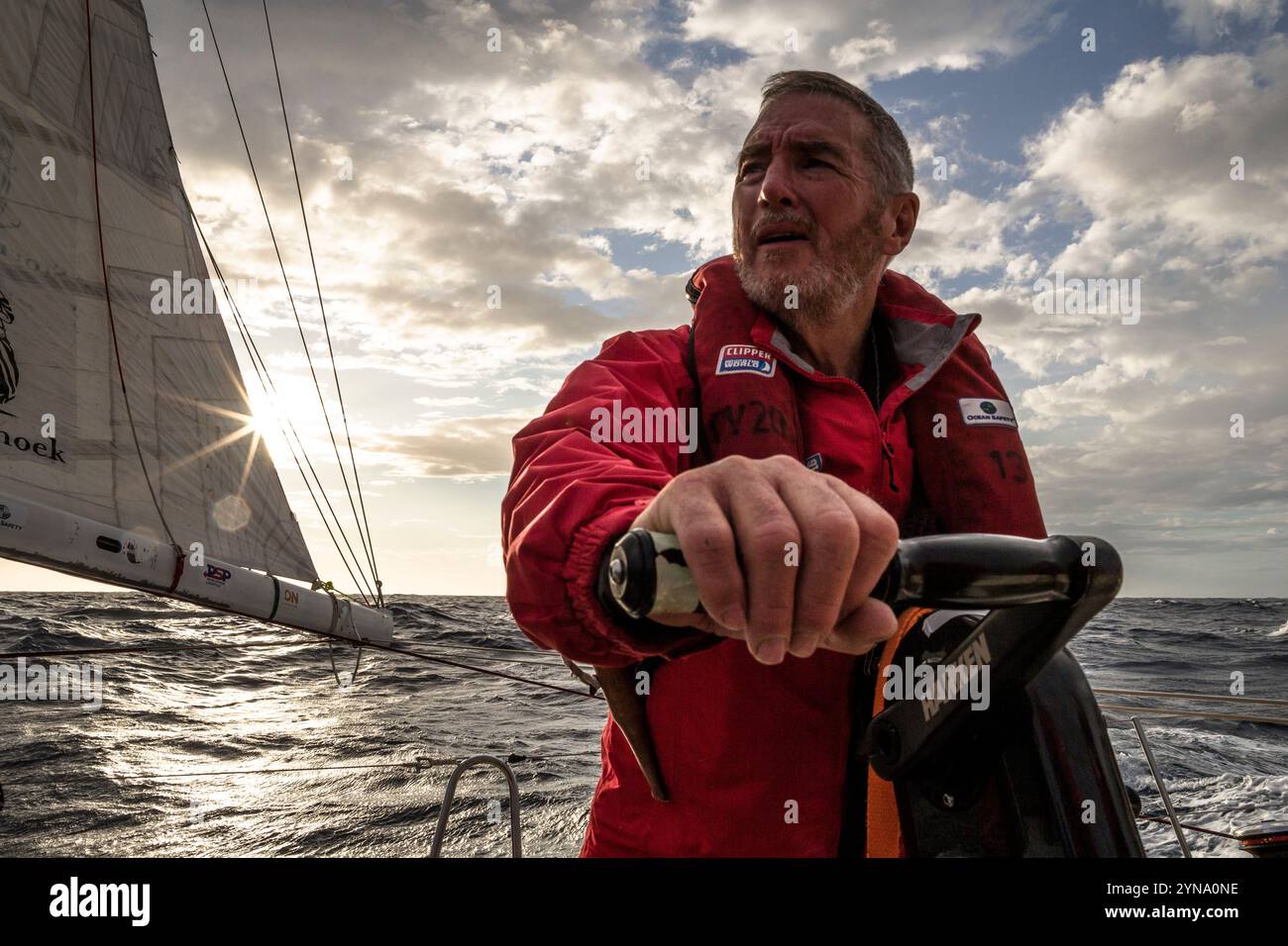 Sailor on the grinder during Sydney to Hobart yacht race, 2015. Stock Photo