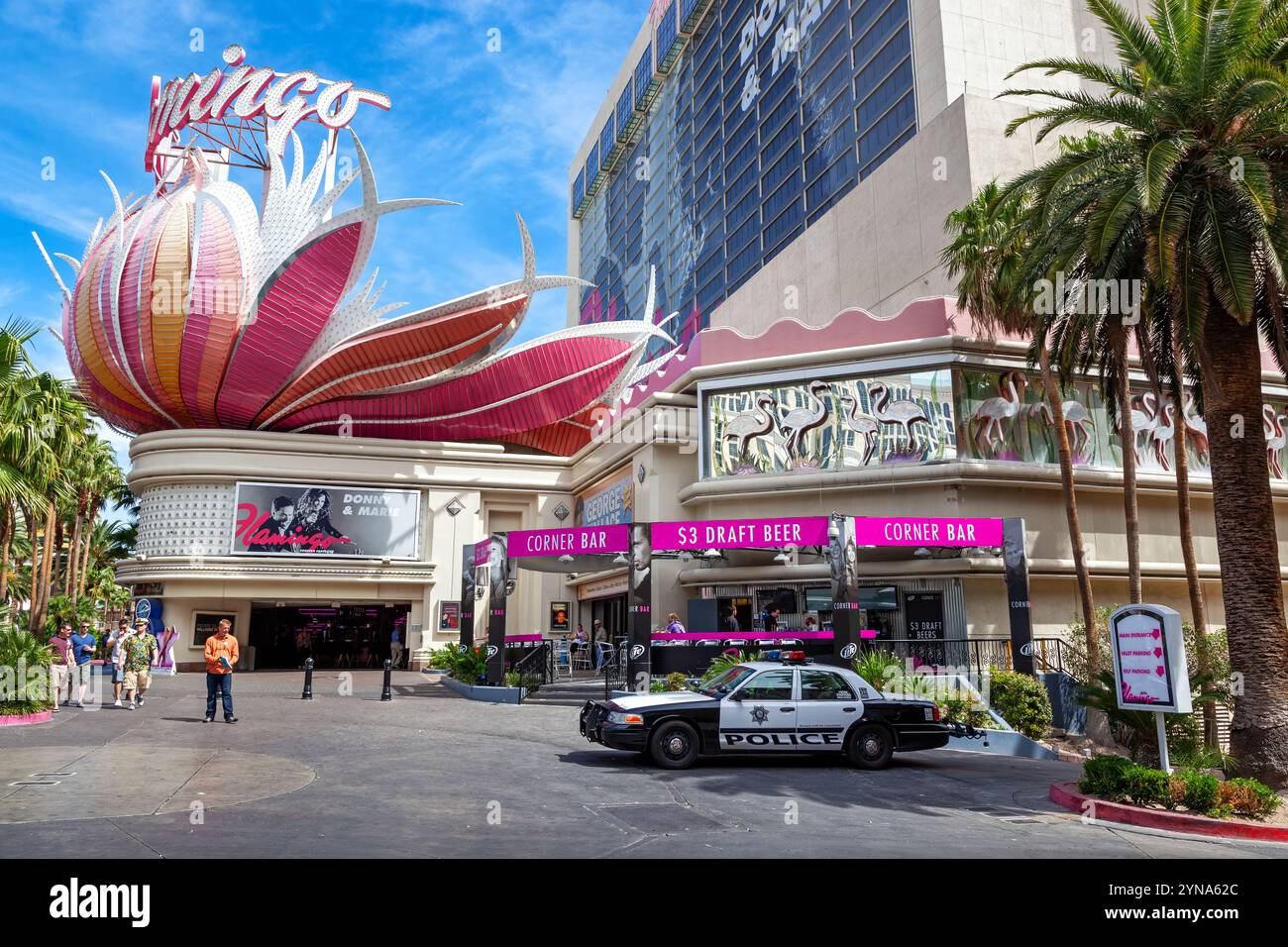 Las Vegas, USA - 18 April 2012: The iconic feather display above the entrance of the famous Flamingo Hotel and casino, the oldest hotel on the Strip, Stock Photo