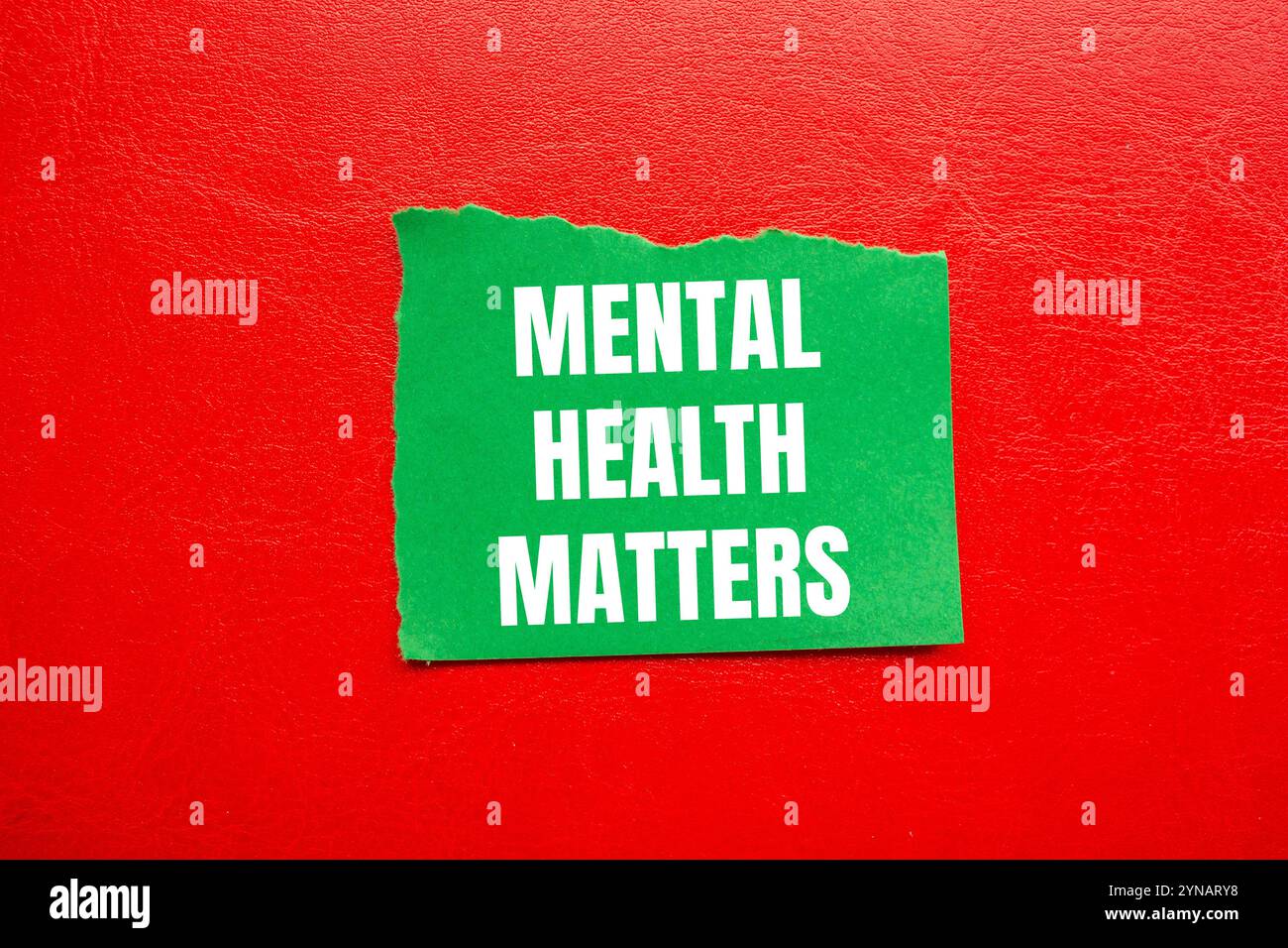 Mental health matters message written on ripped torn green paper piece ...