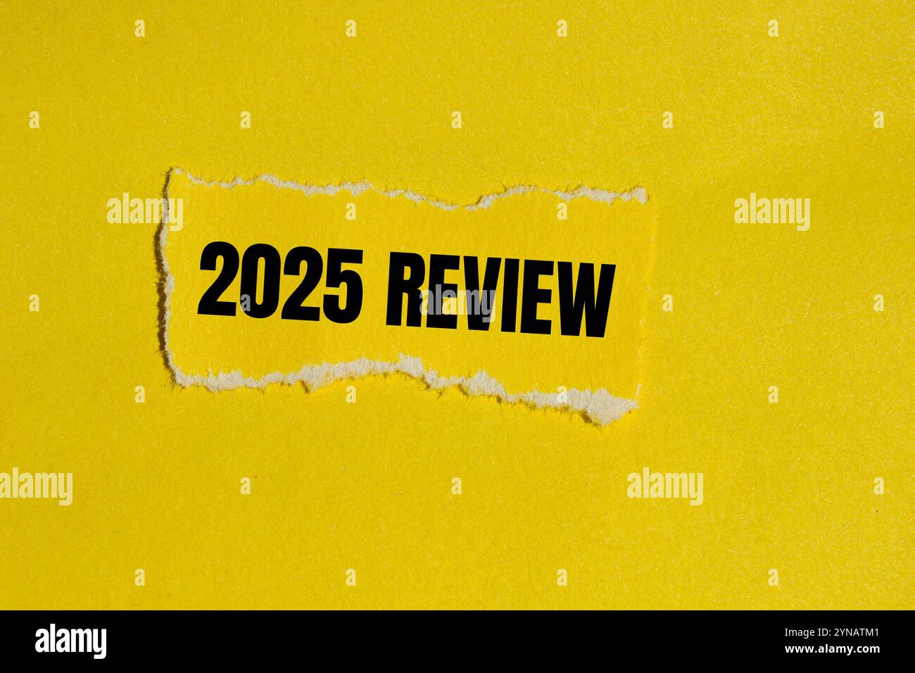 2025 Review Message Written On Ripped Yellow Torn Paper Piece With 2025 Review Message Written On Ripped Yellow Torn Paper Piece With