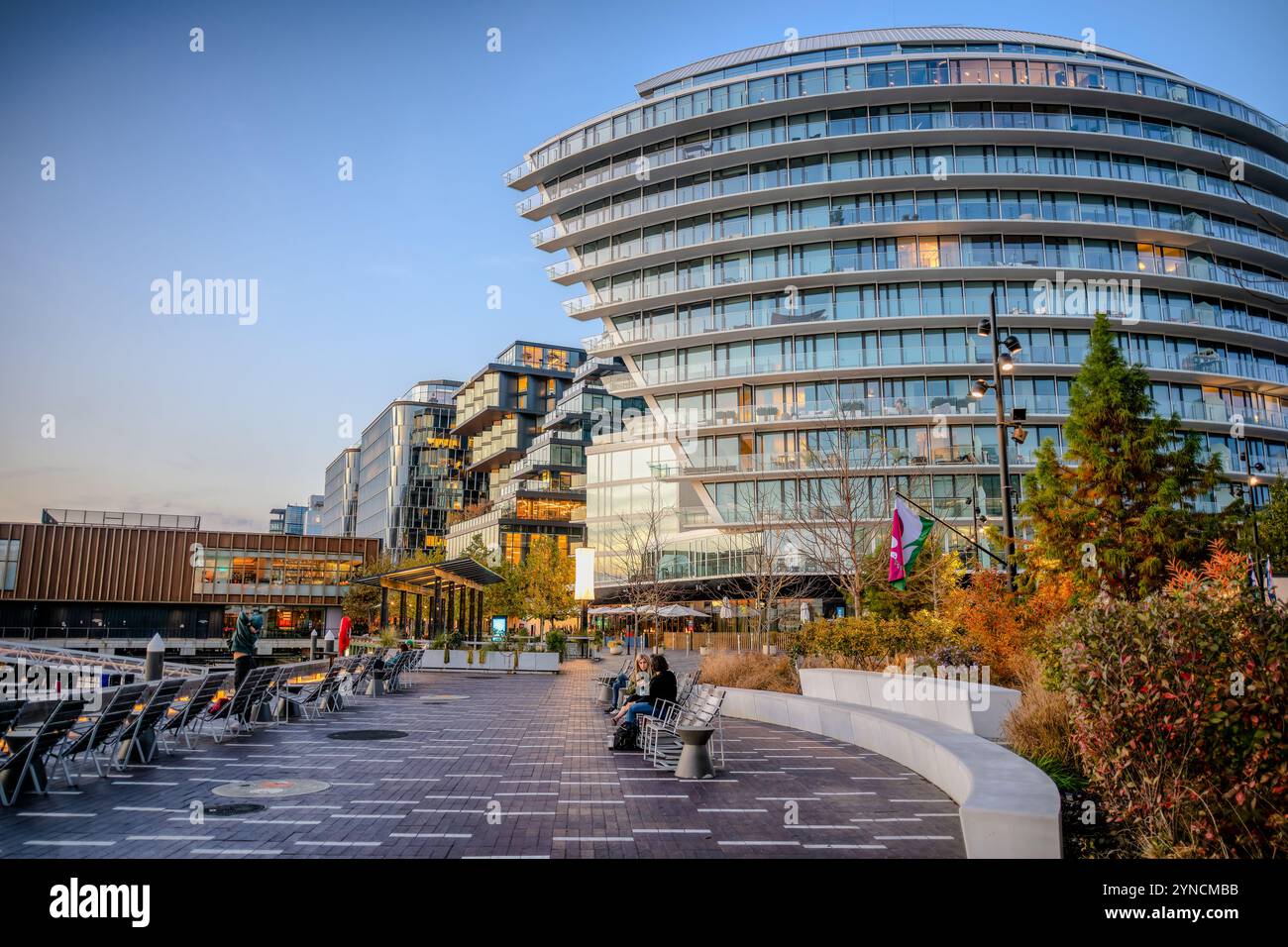 WASHINGTON DC, United States — The Wharf, a mile-long waterfront development along the Washington Channel, represents one of the largest urban renewal projects in the city's history. The mixed-use neighborhood combines residential, commercial, and entertainment spaces along the Southwest Waterfront. The development preserved the historic Maine Avenue Fish Market, established in 1805, making it the oldest continuously operating open-air fish market in the United States. Stock Photo