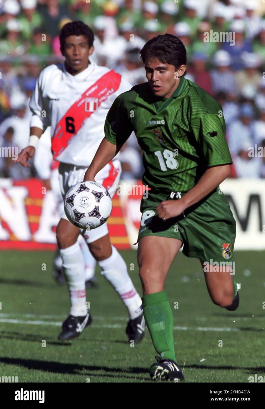 La Paz, Bolivia, September 01, 1996. Jaime Moreno (18) of Bolivia moves away from Josew Soto (6) of Peru during a 1998 World Cup qualifying match between Bolivia and Peru. Stock Photo