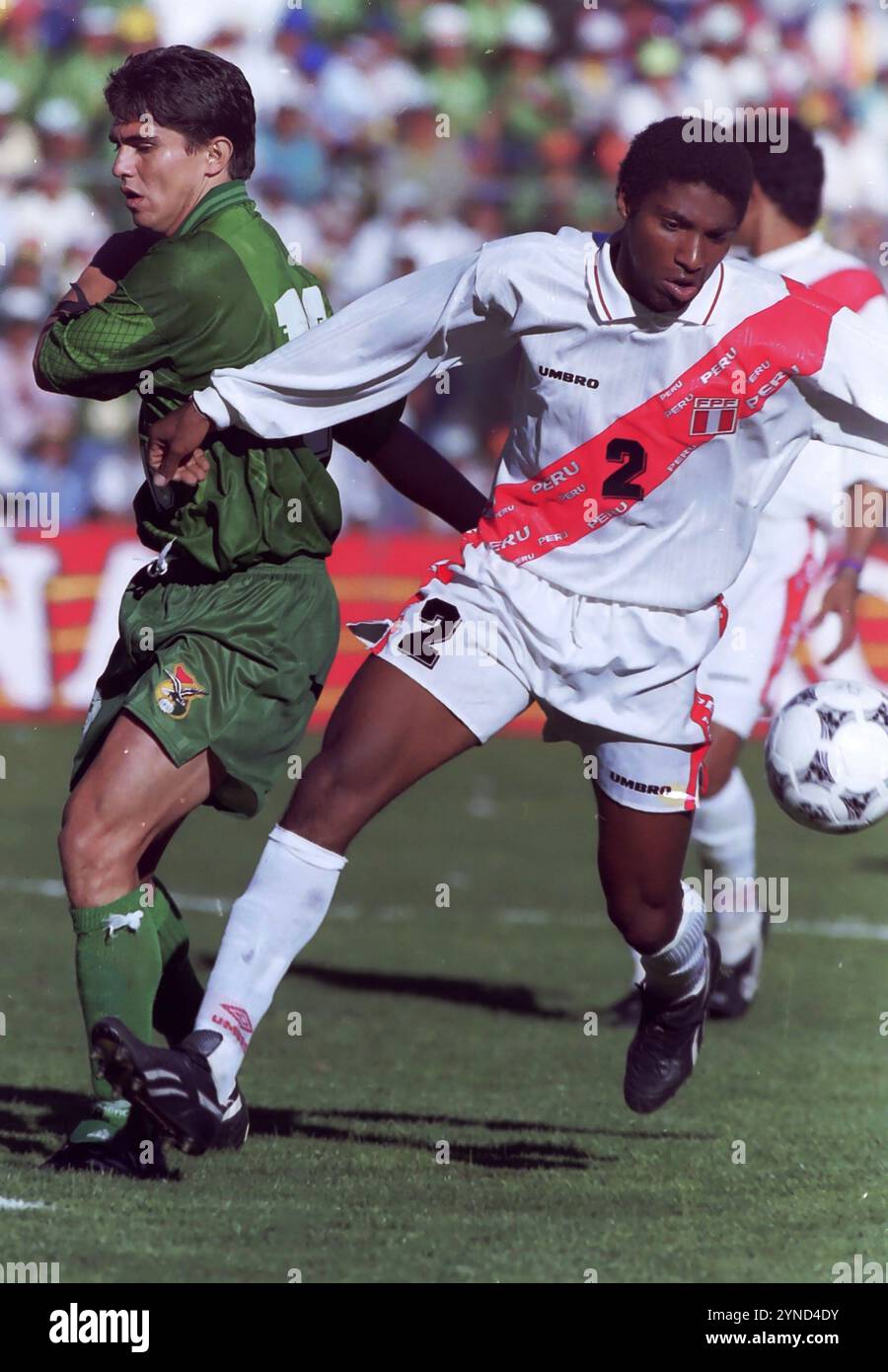 La Paz, Bolivia, September 01, 1996. Jaime Moreno (18) of Bolivia moves away from Josew Soto (6) of Peru during a 1998 World Cup qualifying match between Bolivia and Peru. Stock Photo