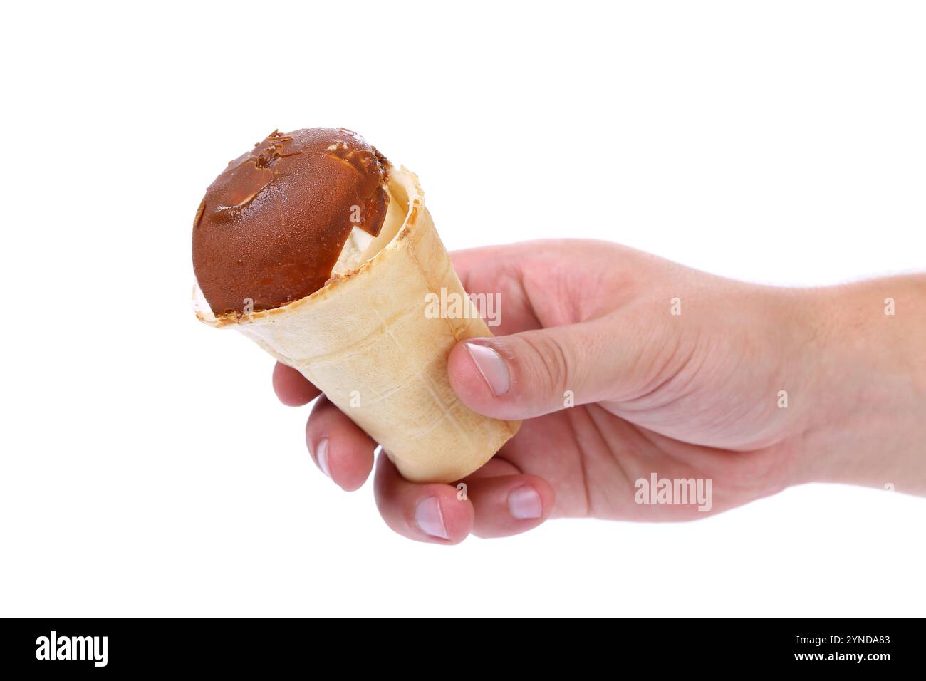 Hand holds waffle cup of chocolate ice cream isolated on white ...