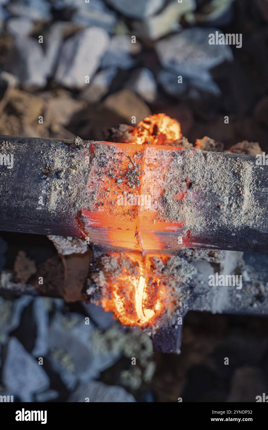Melted Rails Melting metal flows through the rail interface during welding, rail ...