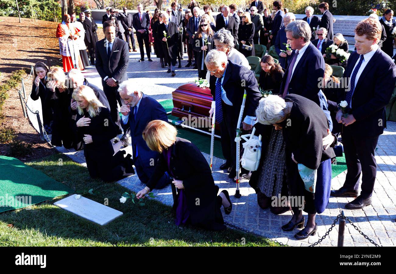 Members of the Kennedy family pray over the grave of Sen. Robert F