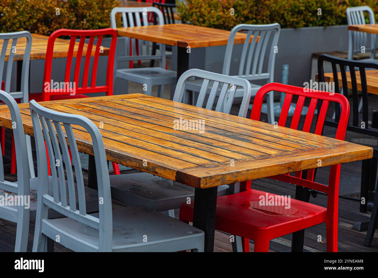 Array of coloured chairs on a rainy day at Lonsdale Quay in North Vancouver Canada Stock Photo