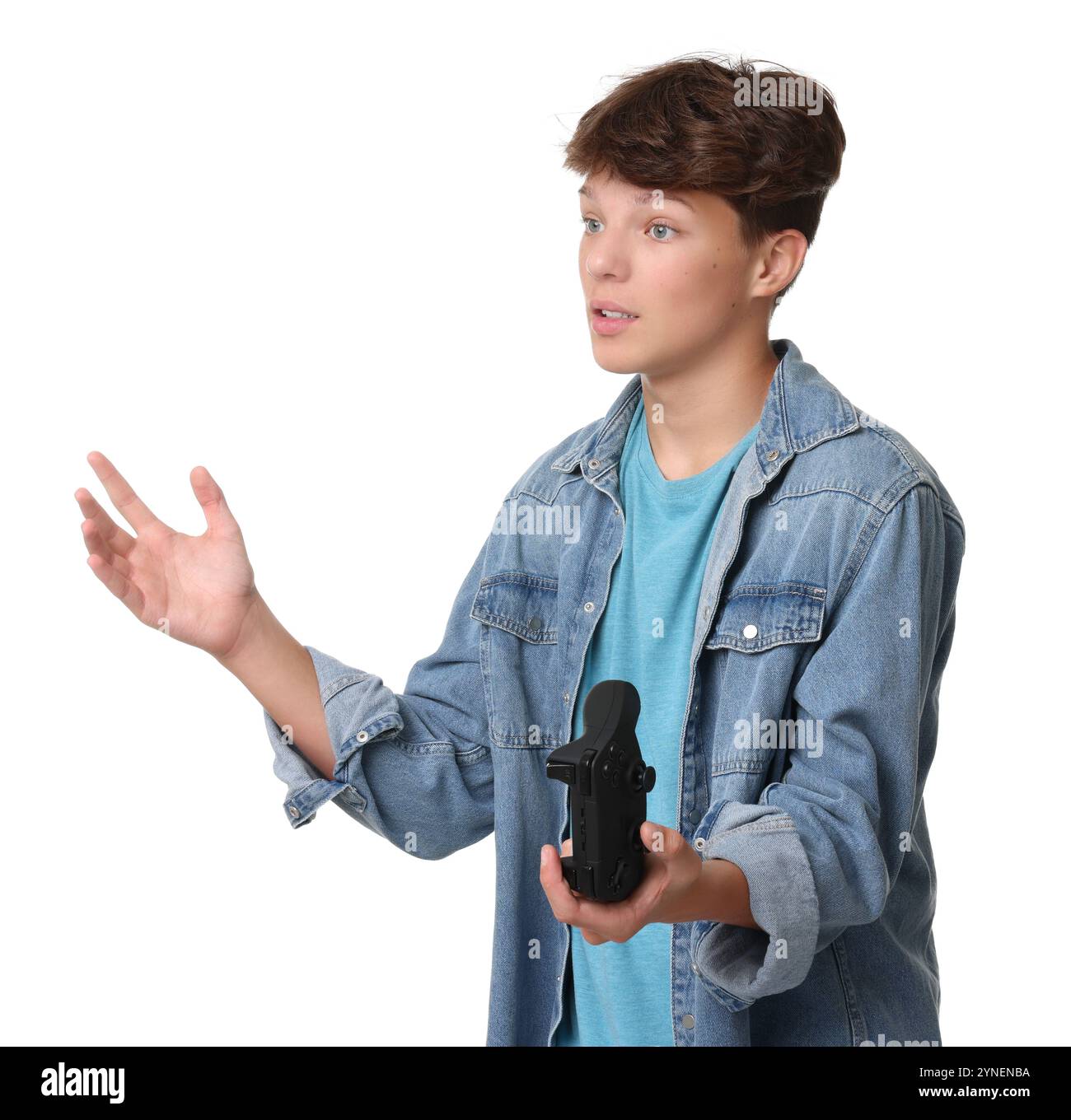 Teenage boy with controller on white background Stock Photo - Alamy