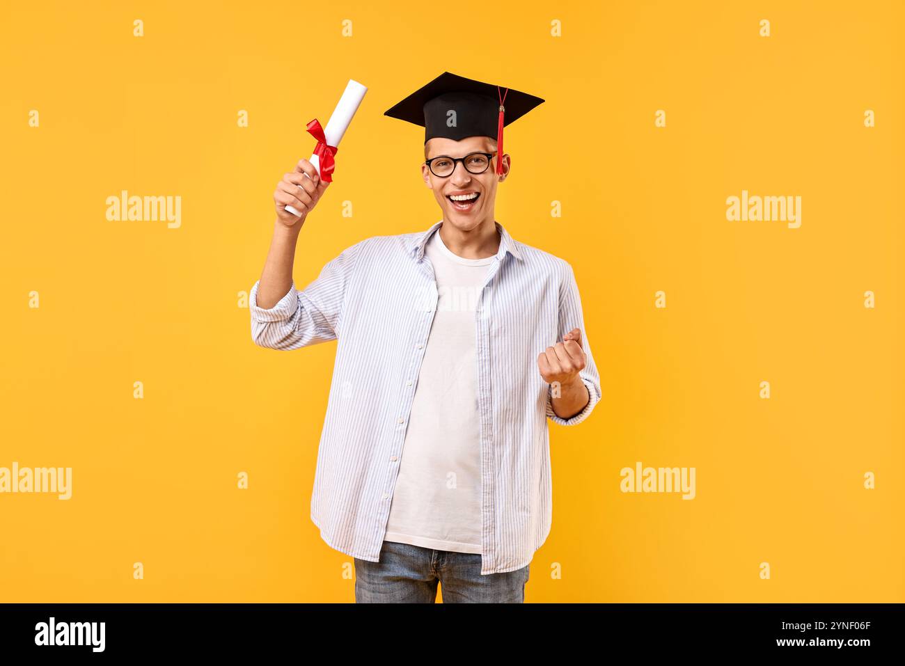 Happy student with diploma after graduation on orange background Stock ...