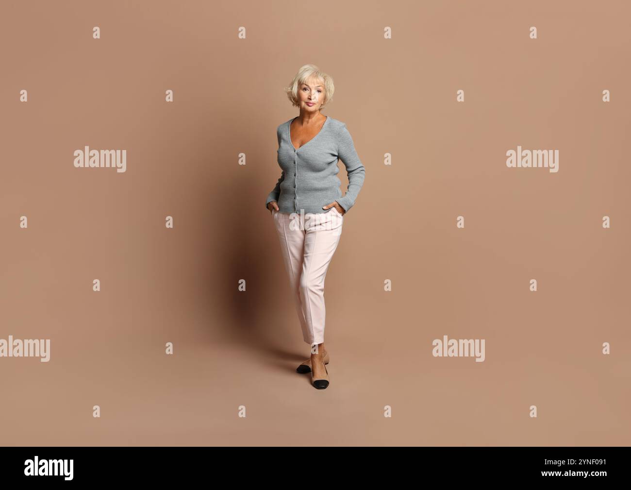 Beautiful older woman full length hi-res stock photography and images ...