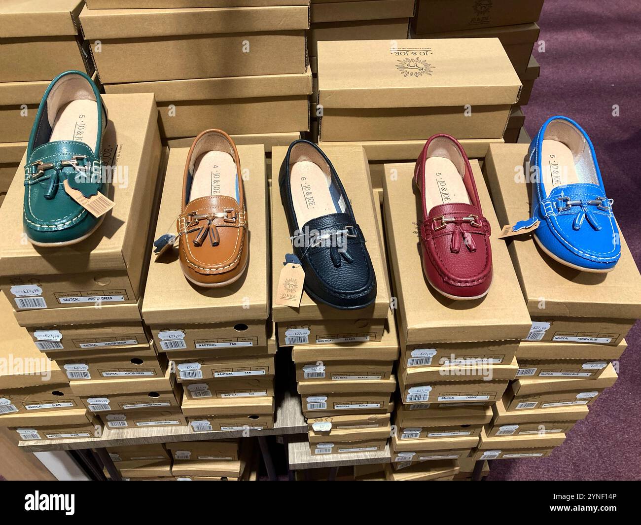 Selection of different coloured womens shoes for sale - Smartphone Captured Stock Image