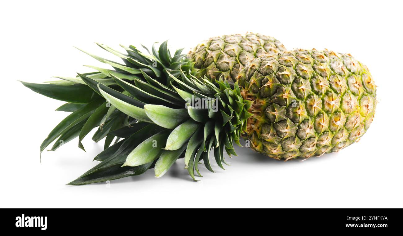 Two fresh ripe pineapples isolated on white Stock Photo