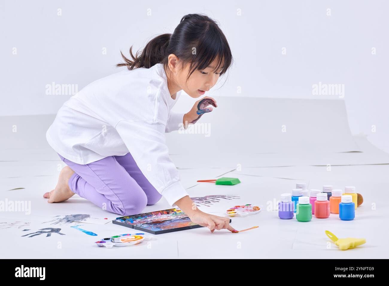 Japanese girl painting on a white background Stock Photo - Alamy
