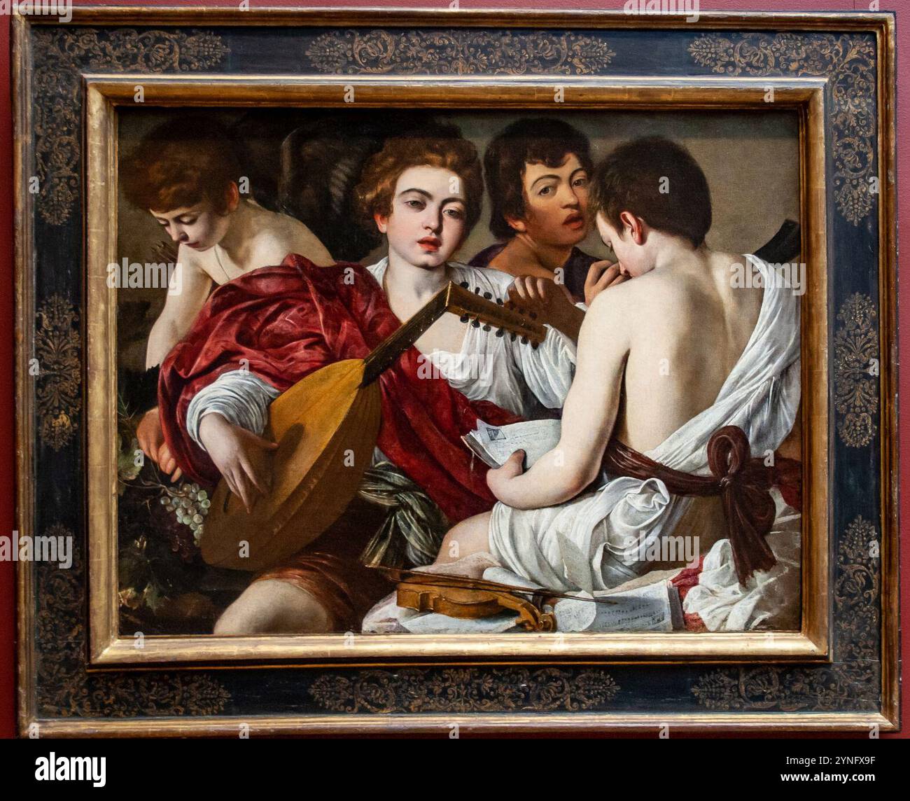 Caravaggio - Musicians - with frame Stock Photo - Alamy