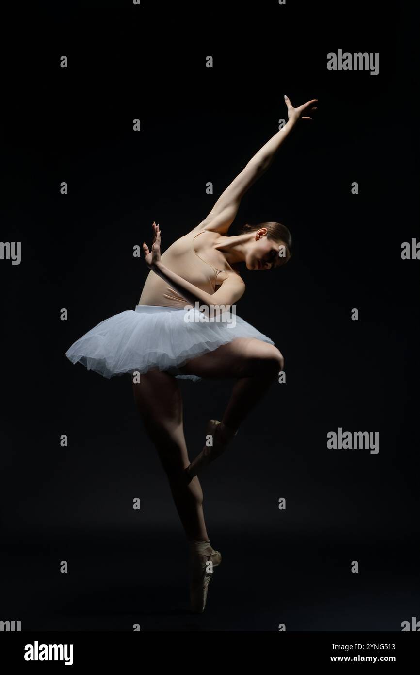 Elegant ballet dancer showcasing grace in a dramatic performance Stock ...