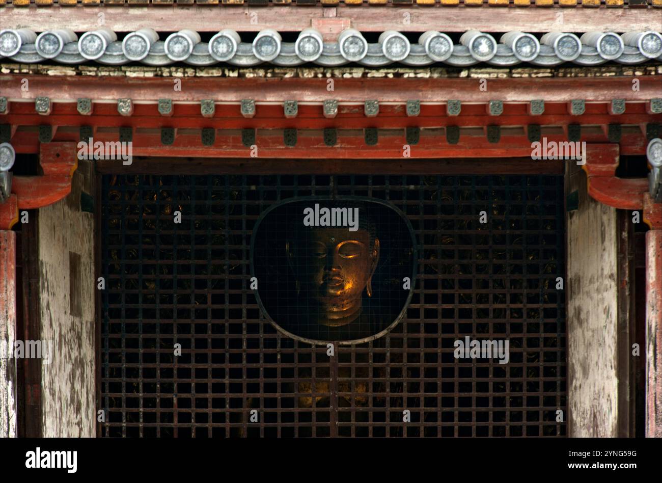 The face of the Amida Buddha statue can be seen through an opening at Byodo-in Temple in Uji, Kyoto, Japan. Stock Photo