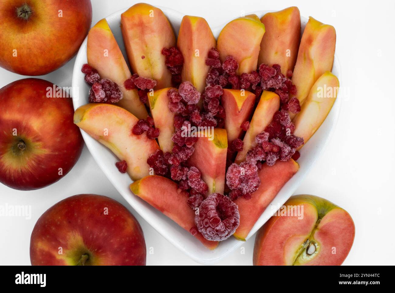 Whole, cut in half and sliced kissabel apple sprinkled with frozen ...