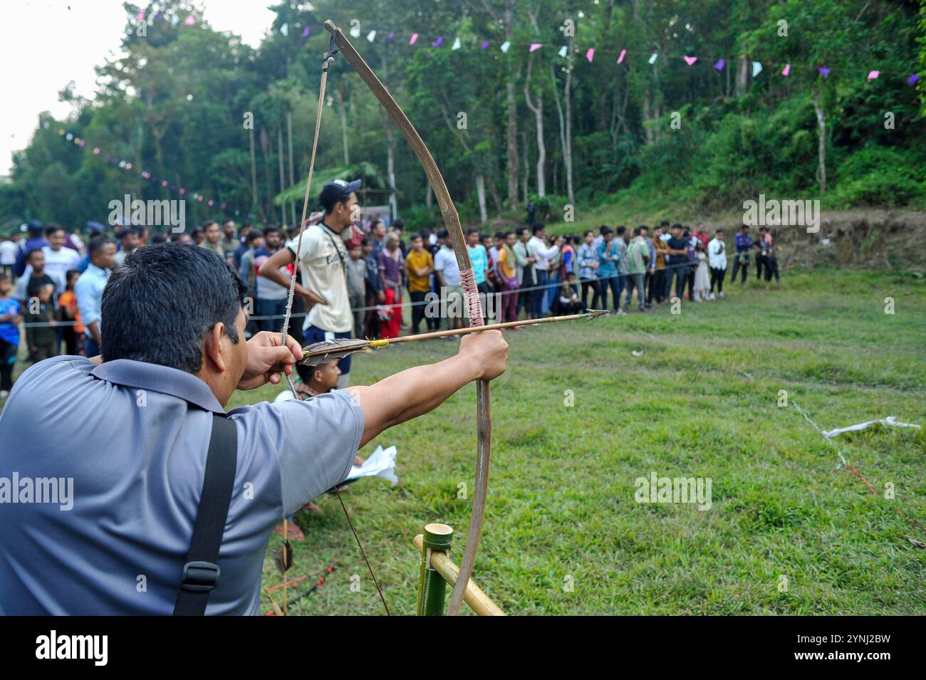 Celebration of Khasi Seng Kut Snem Bangladesh 2024 Khasi tribesmen taking part during a archery and cultural games contest on the occasion to celebrate Khasi Seng Kut Snem. Khasi Seng Kutsnem, is a traditional year-end festival of the Khasi community of Greater Sylhet Division. on November 23, 2024 in Sylhet, Bangladesh. Sylhet Sylhet Bangladesh Copyright: xMdxRafayatxHaquexKhanx Stock Photo