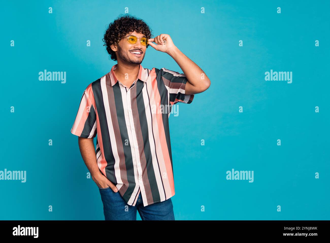 Portrait of nice young man look empty space wear shirt isolated on ...