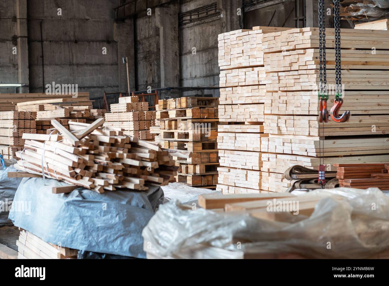 Stacked wooden planks close-up at lumber warehouse. Wood industry ...