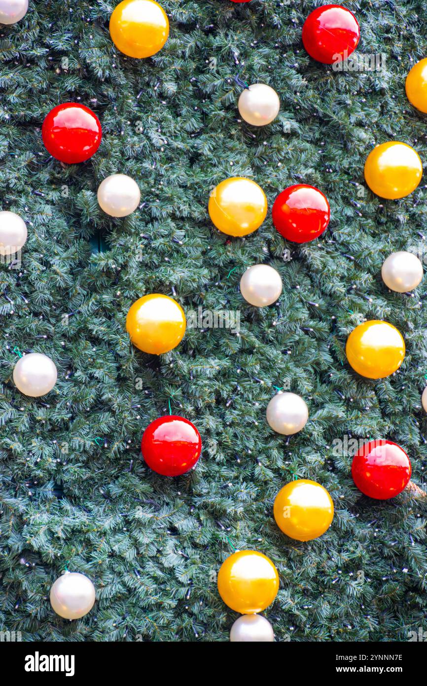 Christmas baubles on an artificial tree background Stock Photo