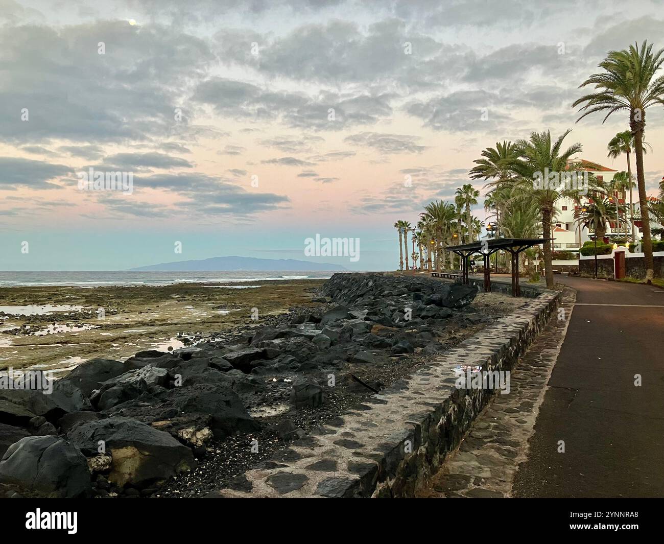 Looking towards the island of La Gomera from the Playa de las Américas beachfront. Arona, Tenerife, Canary Islands, Spain. 8th February 2023. - Smartphone Captured Stock Image