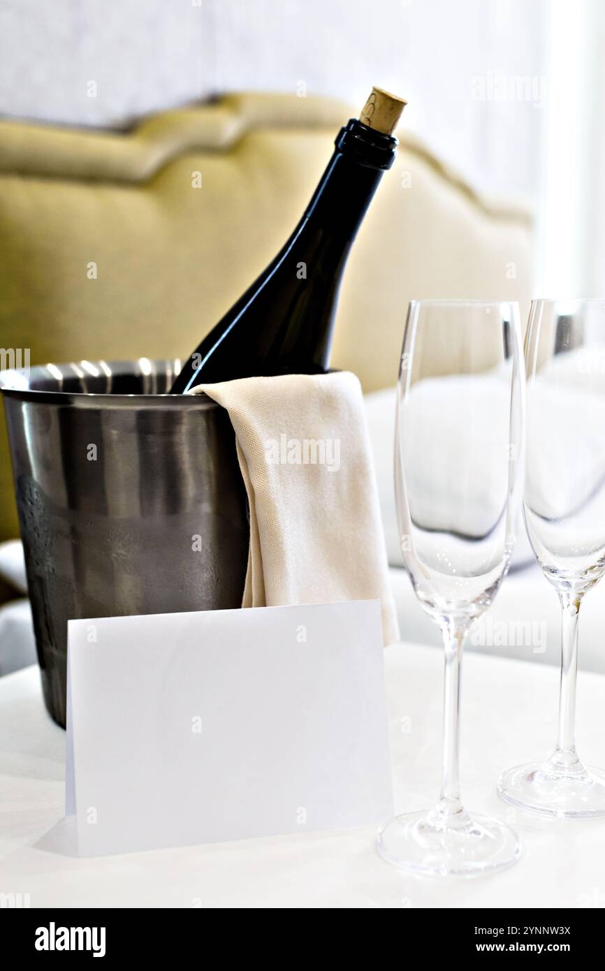 Honeymoon concept. Champagne bucket near bed in a hotel room Stock ...