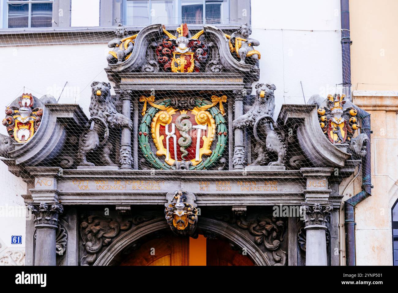 Blacksmiths' guild house from 1393, a baroque portal with a representation of a hammer and pliers was added in 1653. Wonderful baroque doorway carved Stock Photo