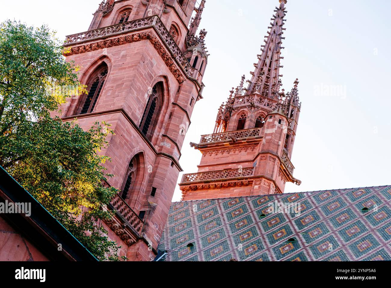 Twin towers and tiled roof. Basel Minster is a religious building in ...