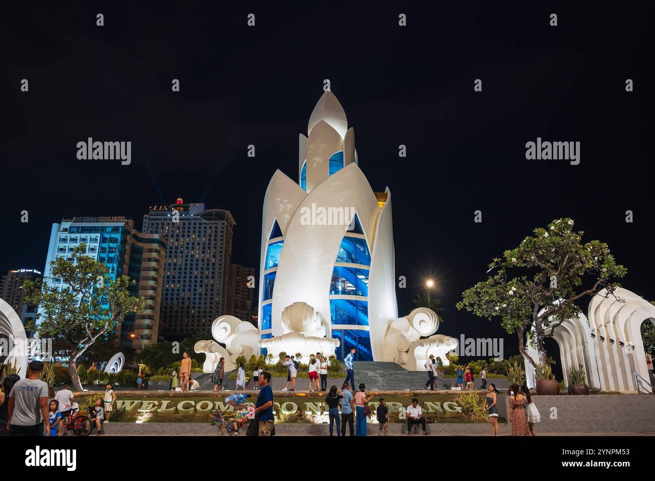 Tourist attraction is the Lotus Tower or Thap Tram Huong Tower on the central square at night in Asia. Nha Trang, Vietnam - September 2, 2024 Stock Photo