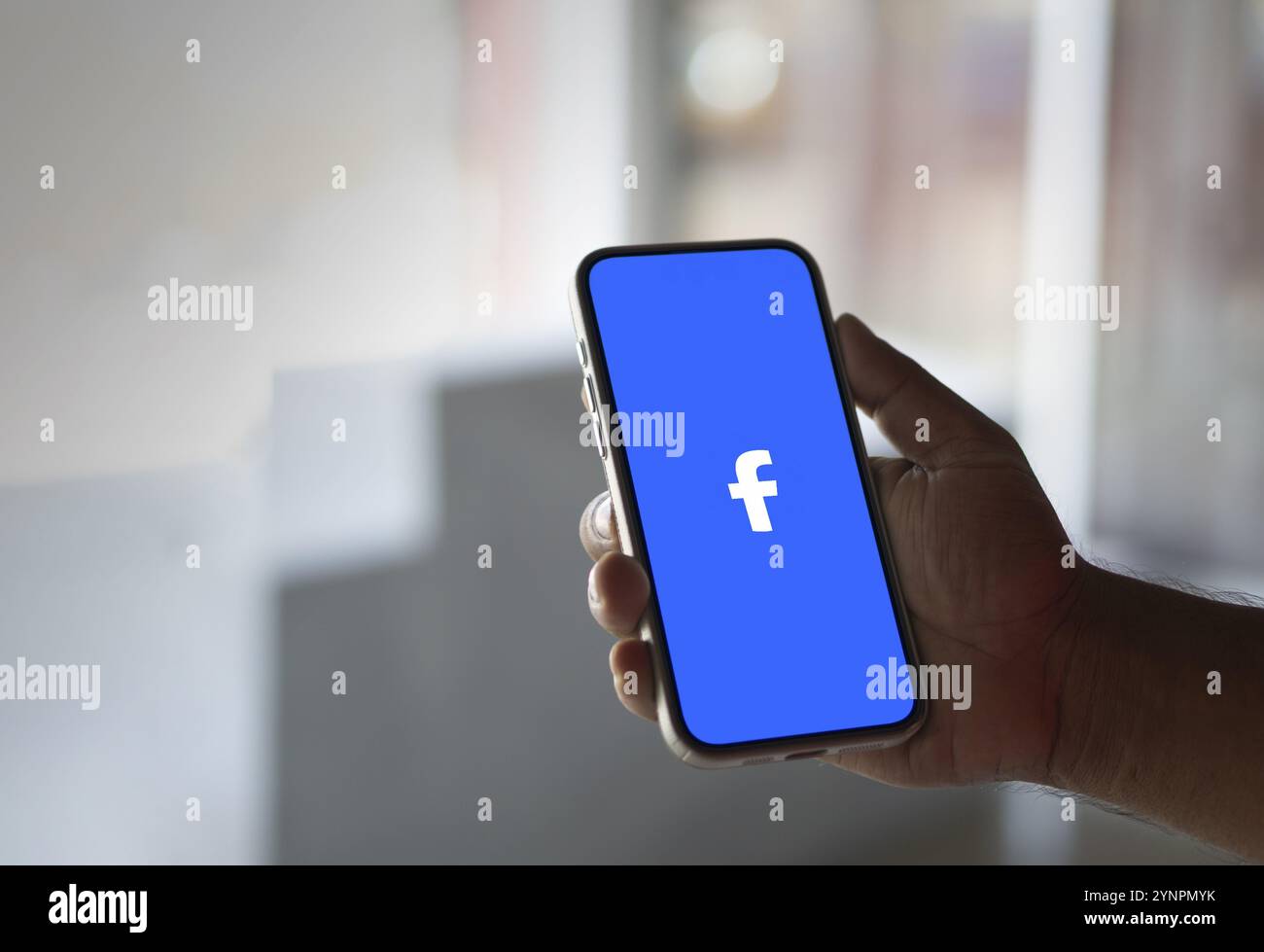 Facebook logo displayed on smartphone screen Stock Photo - Alamy