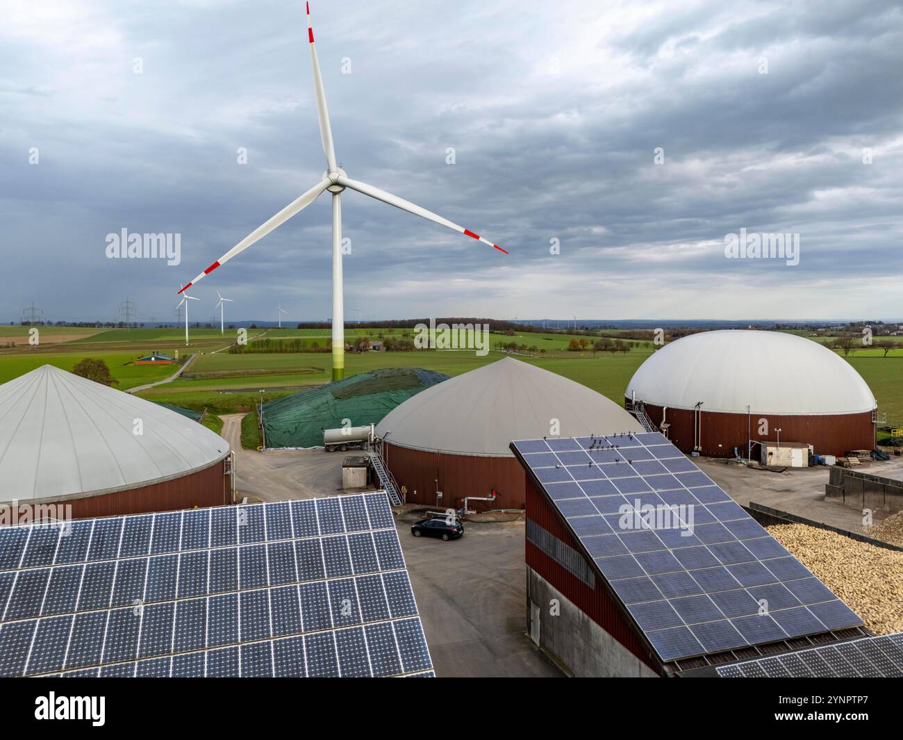 Biogas plant produces gas from biomass, electricity is generated in combined heat and power plants with the biogas produced and sold to companies in t Stock Photo