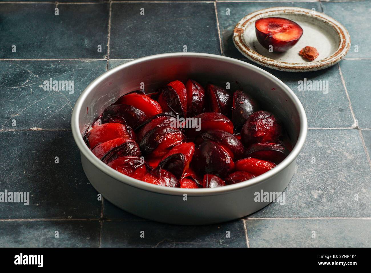 Plum tarte tatin before baking, red plums Stock Photo
