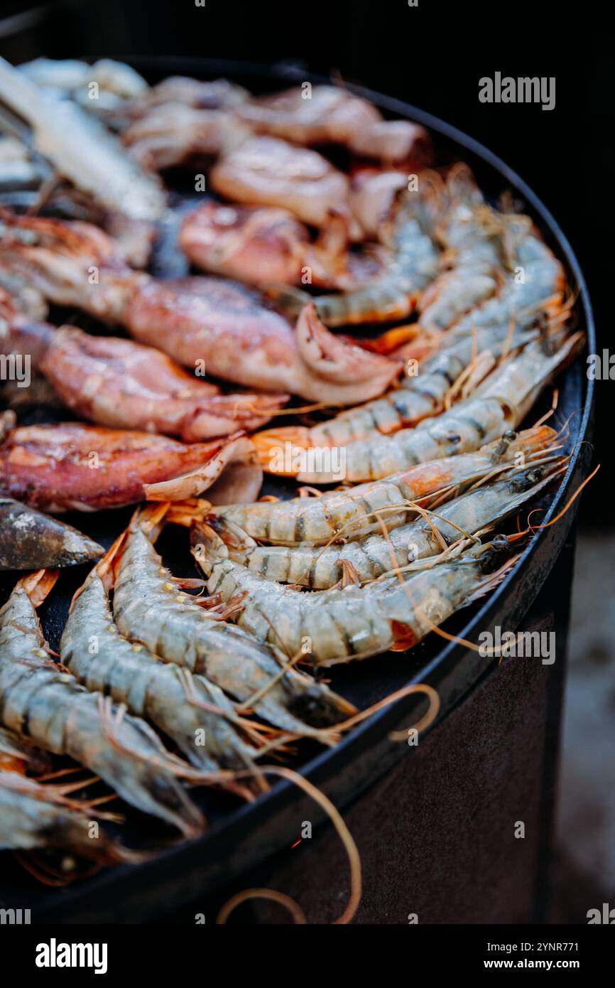 Grilled shrimp and seafood sizzling on a hot plate for a gourmet culinary experience Stock Photo