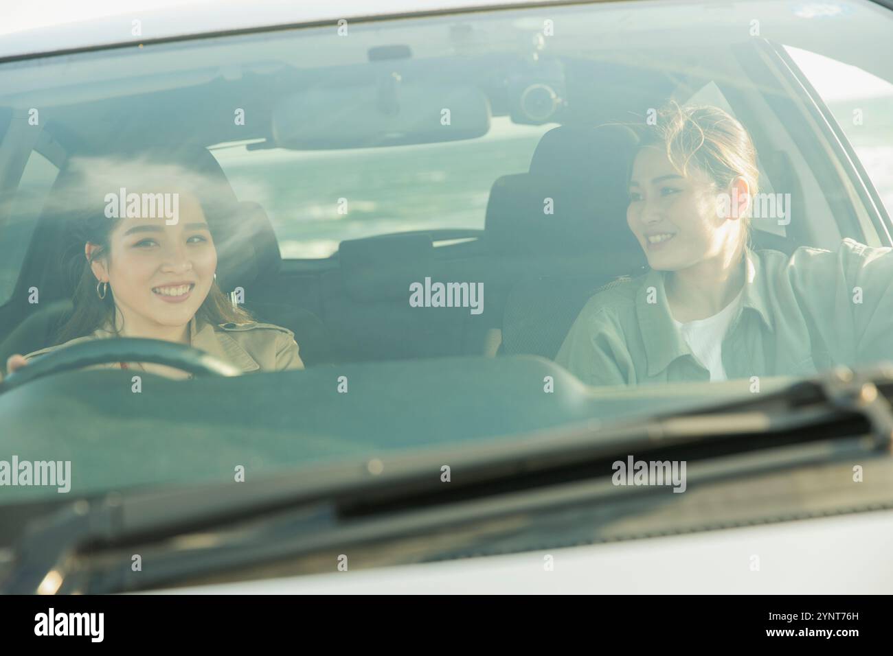 Talking In A Car Businesswoman driving car talking hi-res stock photography and images ...