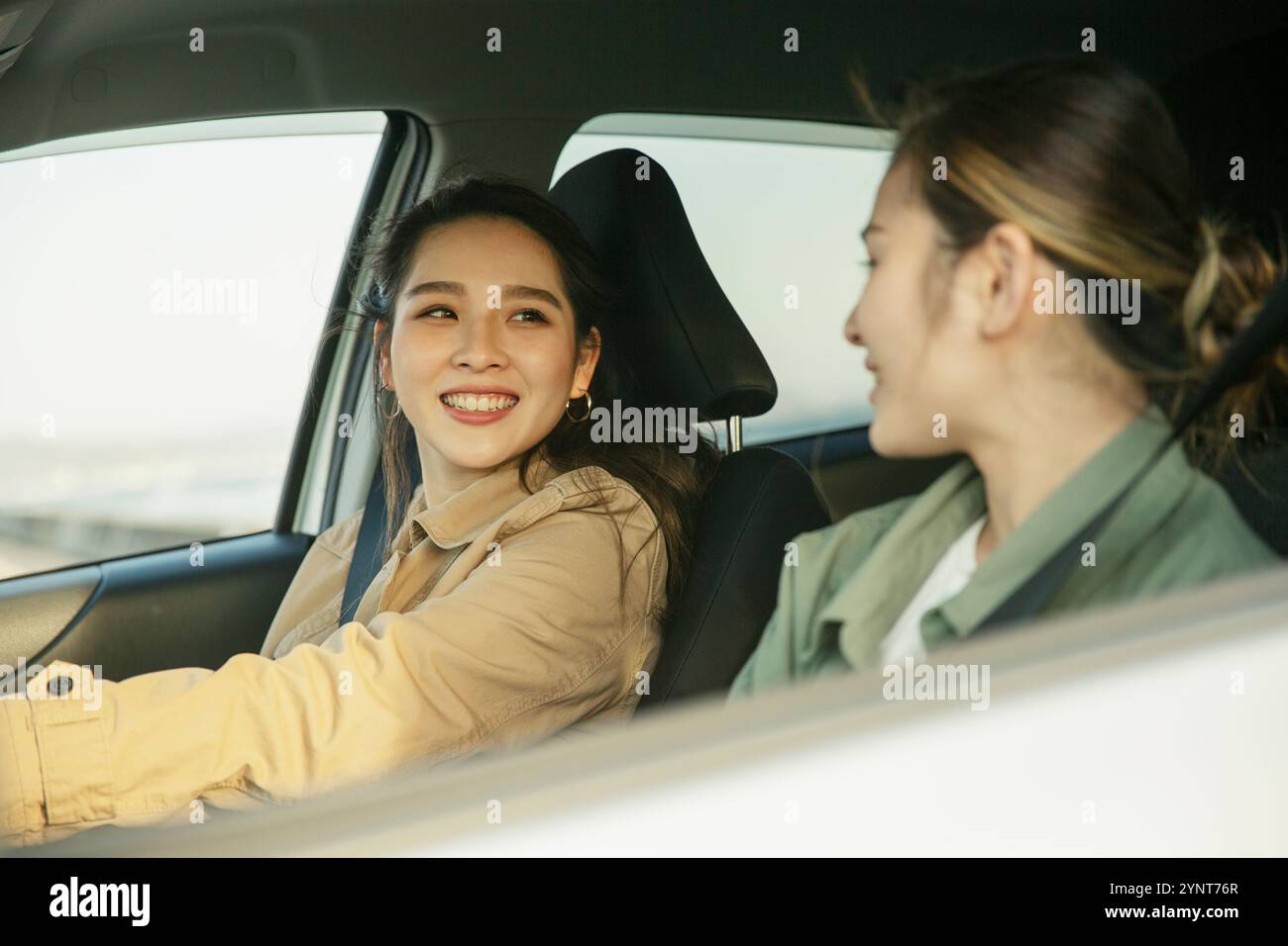 Talking In A Car Two women in their 20s talking in a car Stock Photo - Alamy