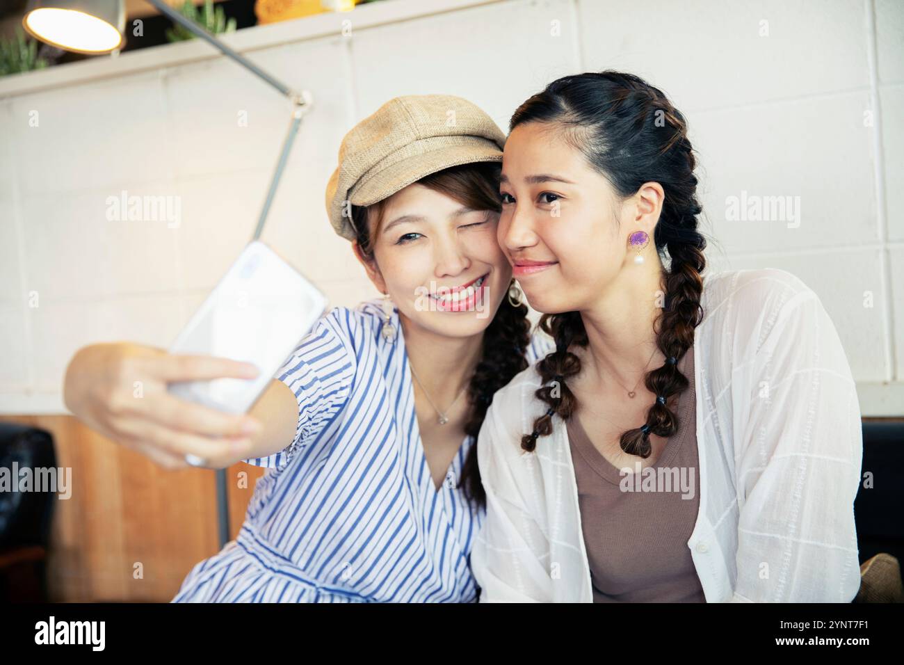 Two women in their 20s taking a selfie Stock Photo - Alamy