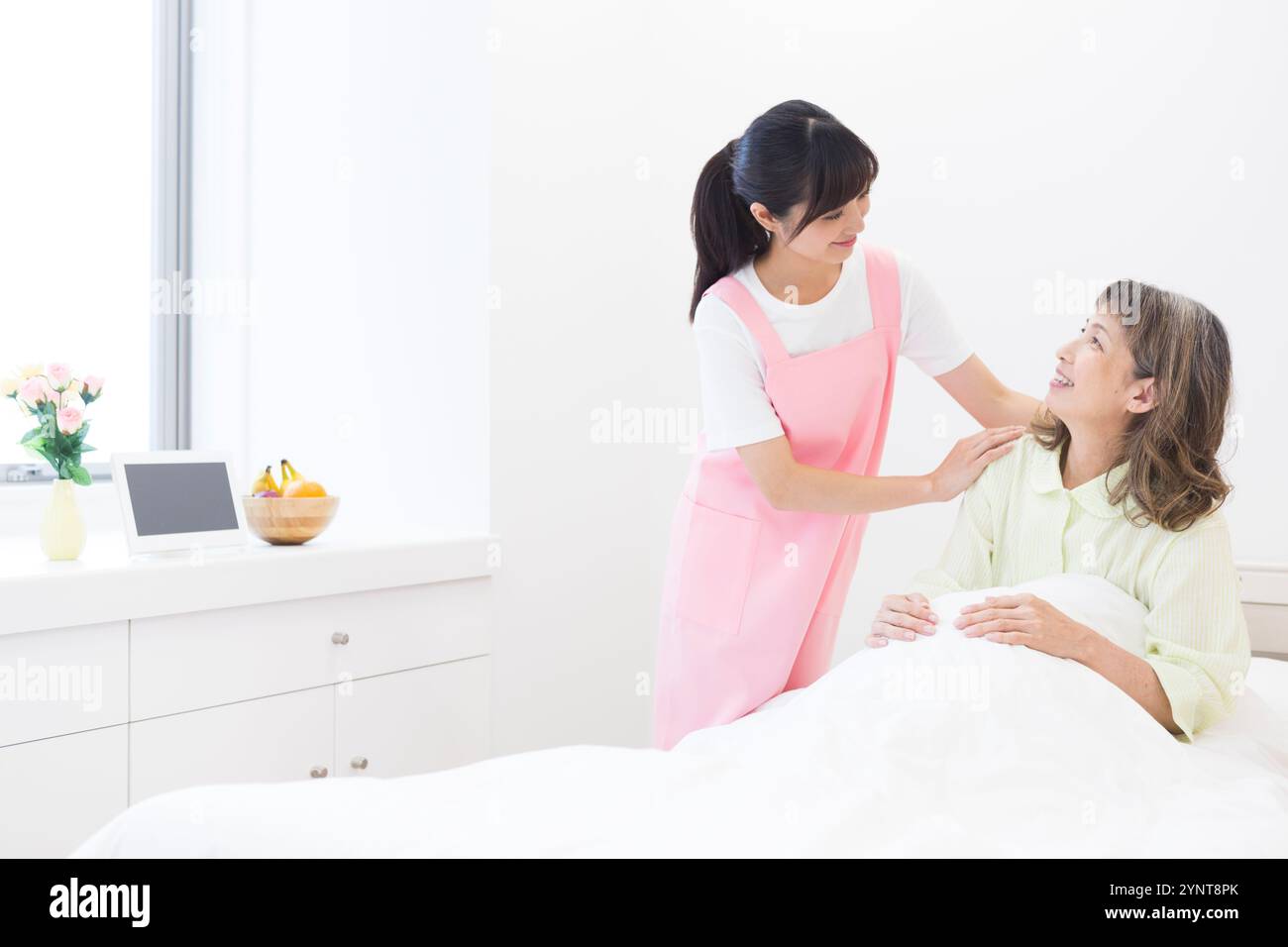 Woman and senior woman providing care Stock Photo - Alamy