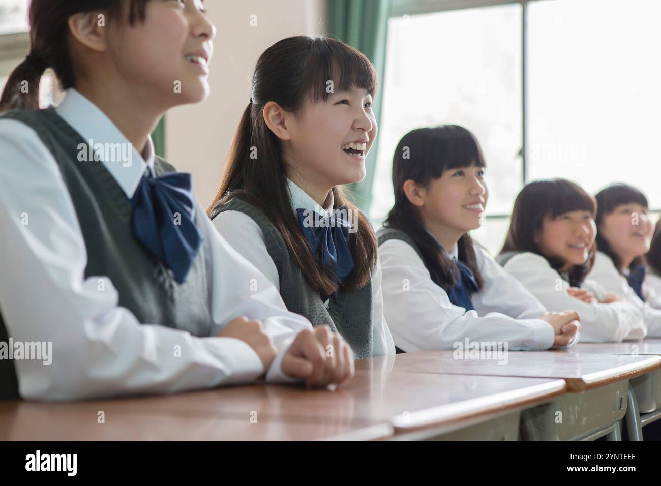 Female student sitting in classroom Stock Photo - Alamy