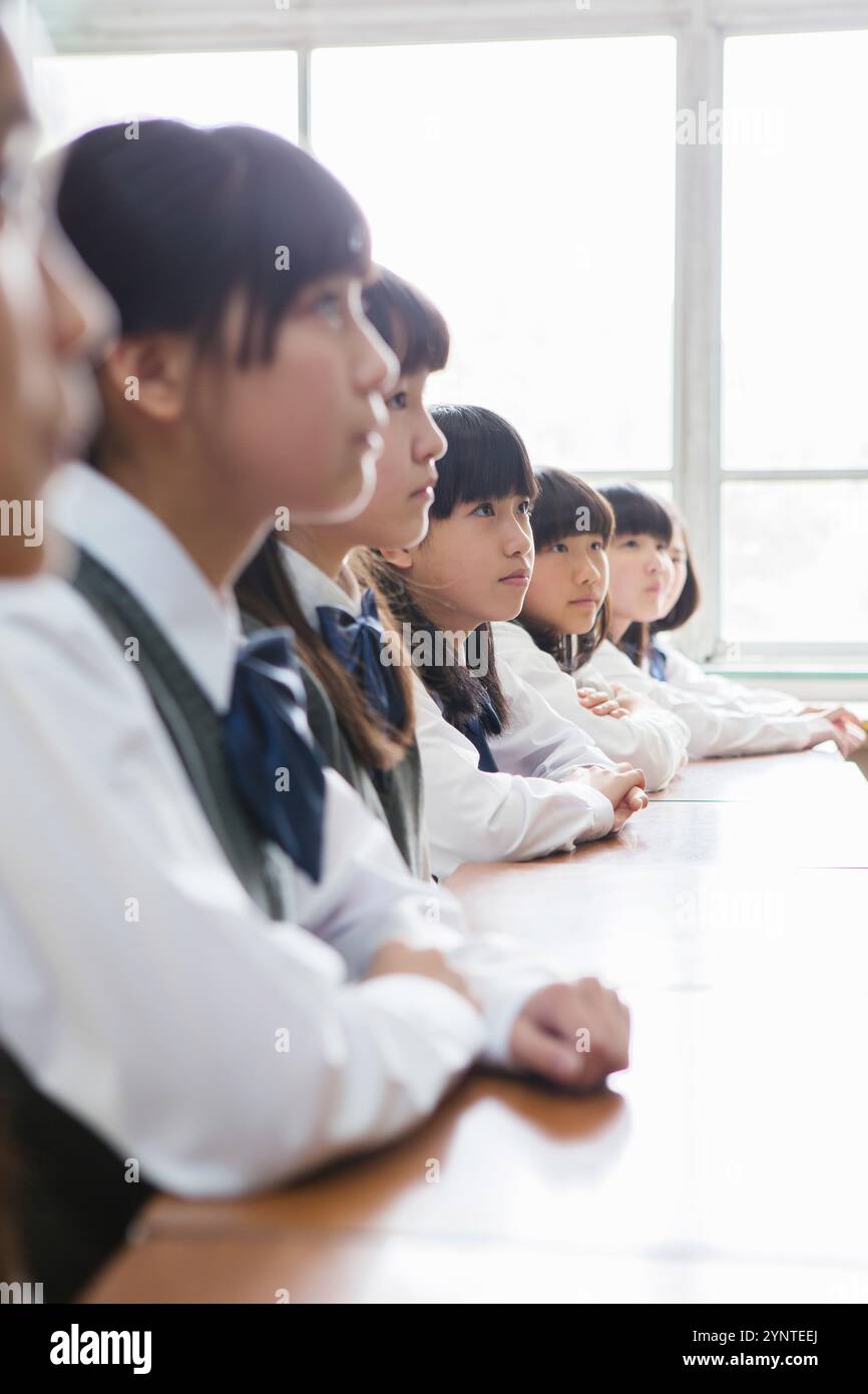 Female student sitting in classroom Stock Photo - Alamy