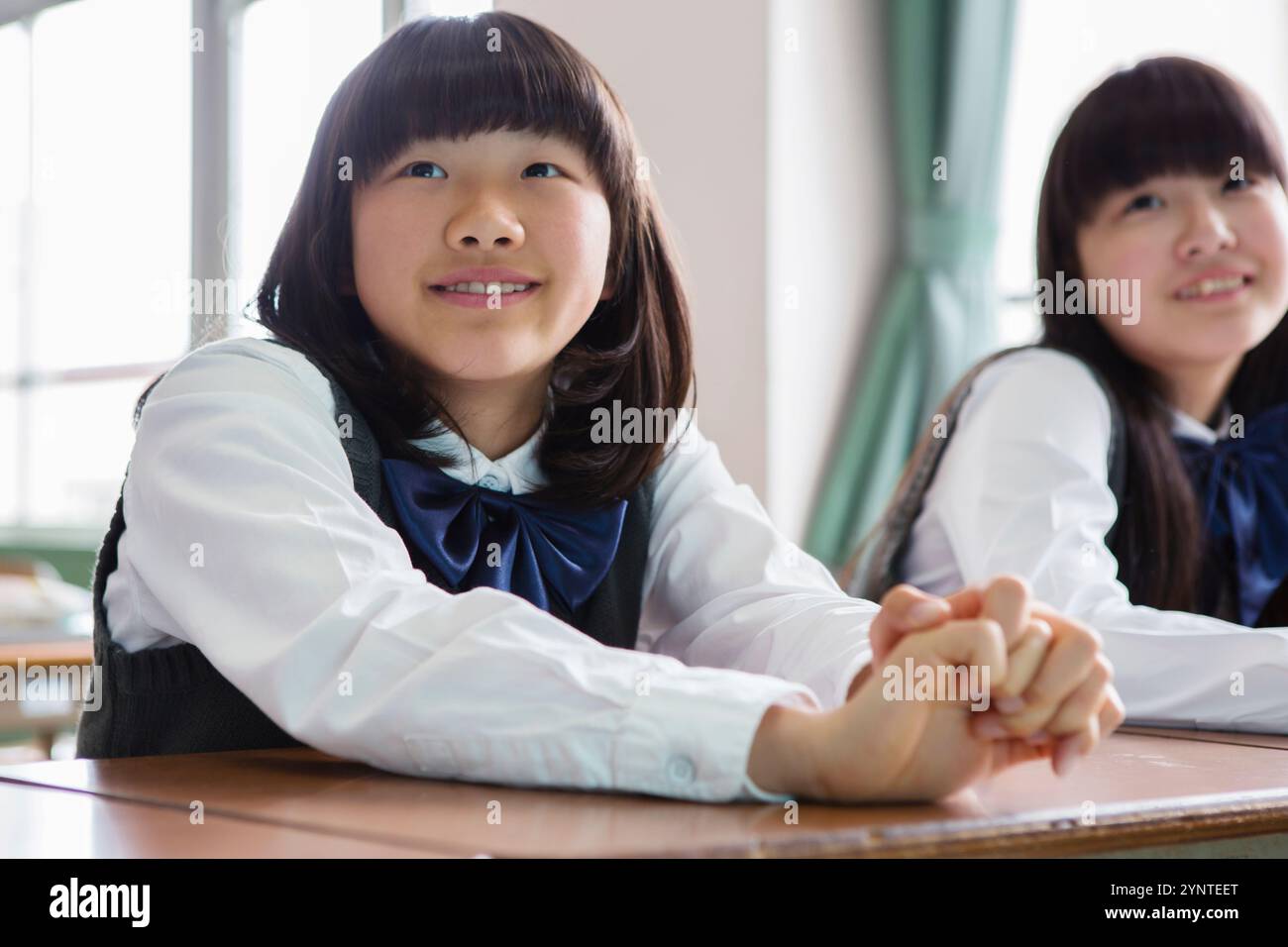 Female student sitting in classroom Stock Photo - Alamy