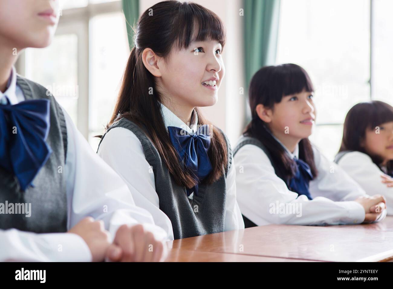 Female student sitting in classroom Stock Photo - Alamy