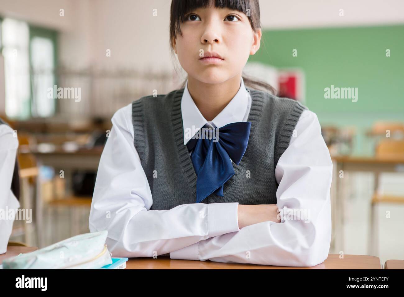 Female student sitting in classroom Stock Photo - Alamy