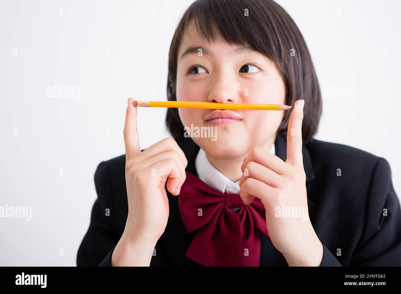 Female high school student and pencil Stock Photo - Alamy