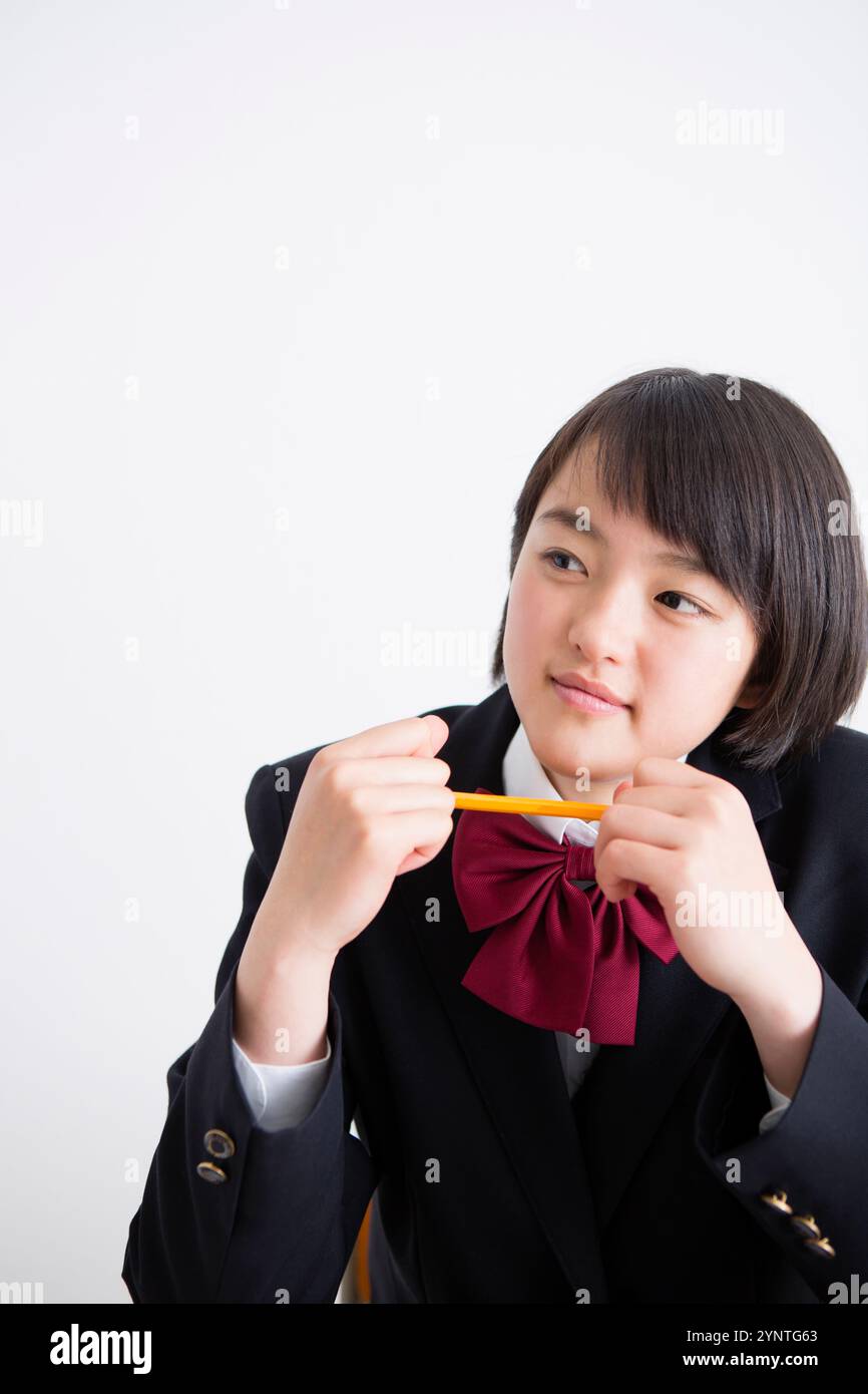 Female high school student and pencil Stock Photo - Alamy